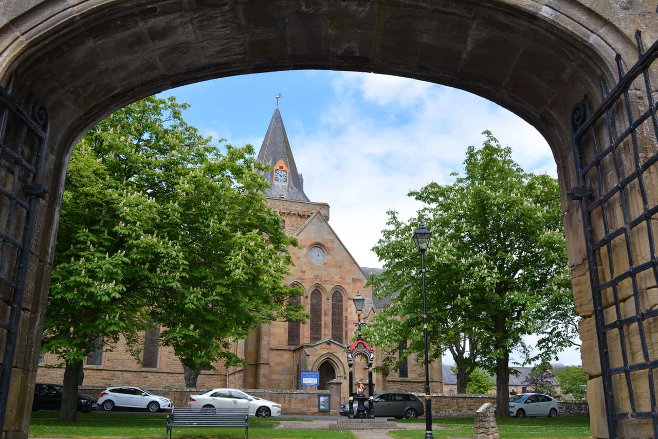 Dornoch Cathedral seen through an arch, near Invergordon