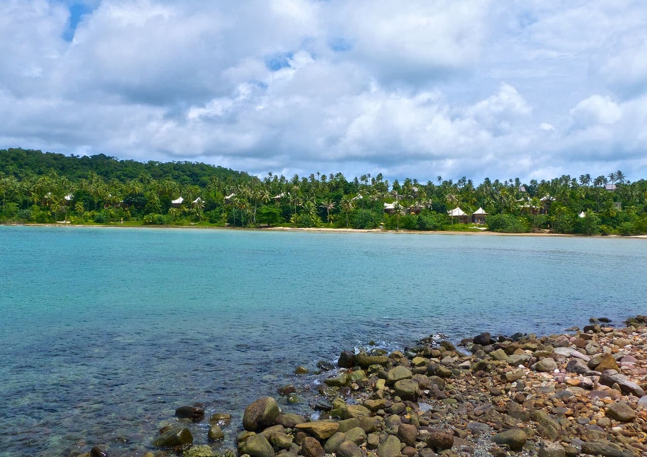 Tropical bay with palm-fringed shore on Ko Kut